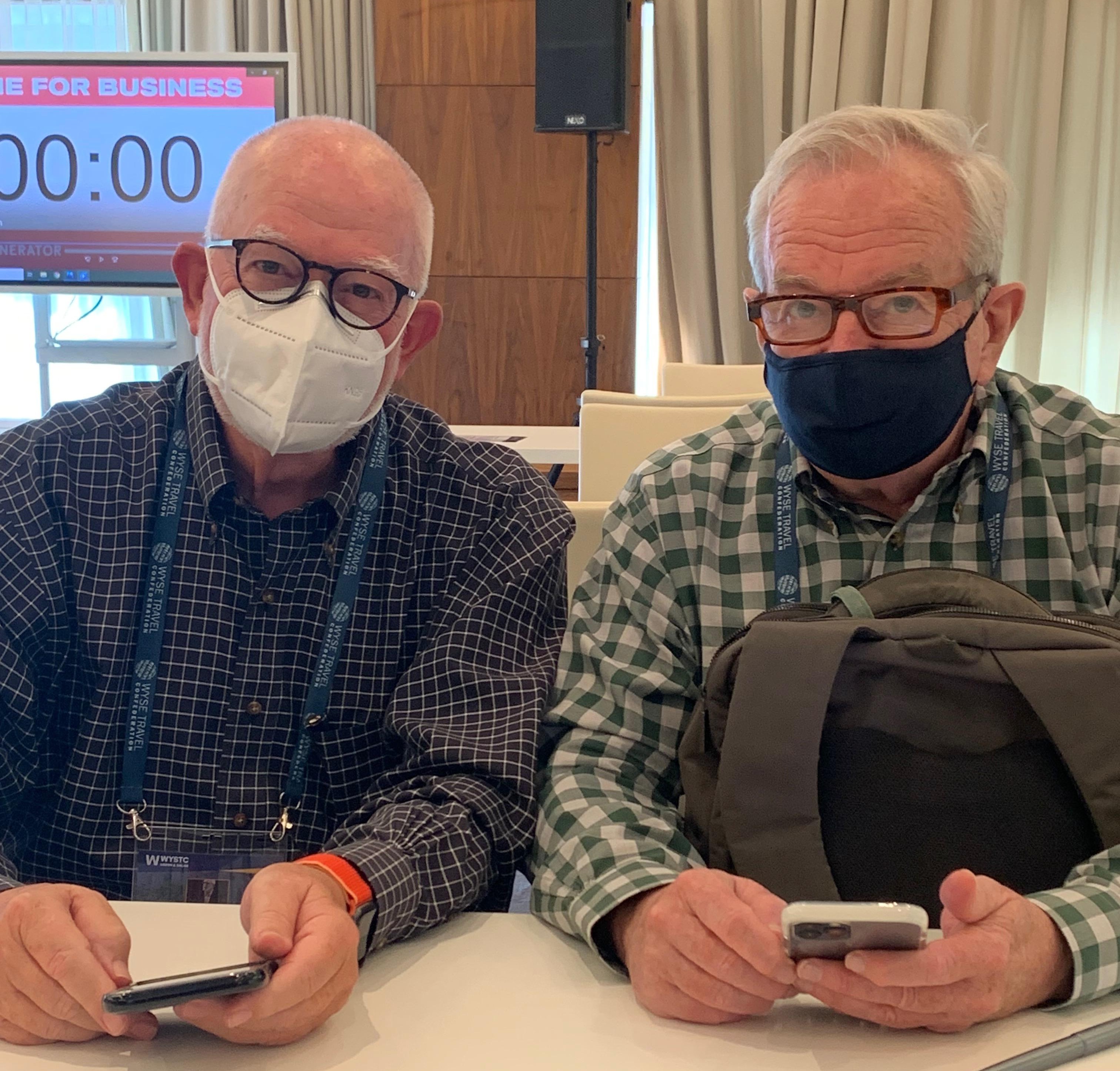 randy and kevin wearing masks at the wystc conference in lisbon