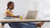 black-female-student-pretty-young-woman-studying-at-home-using-laptop-writing-at-no-SBV-346506408-HD-thumb