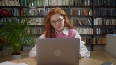 focused-girl-with-red-hair-student-using-laptop-search-information-internet-course--SBV-347139920-HD-thumb-2